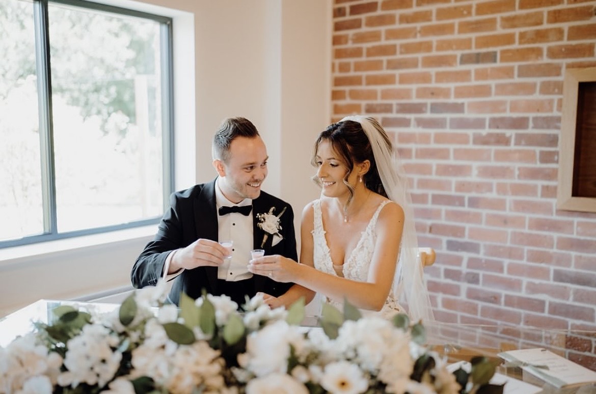 A bridal couple drinking A Unity Shot
